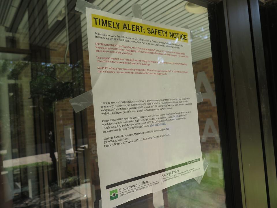 Photo by Diamond Victoria Alerts regarding a recent attack of a woman on the jogging trail are taped on doors throughout campus.