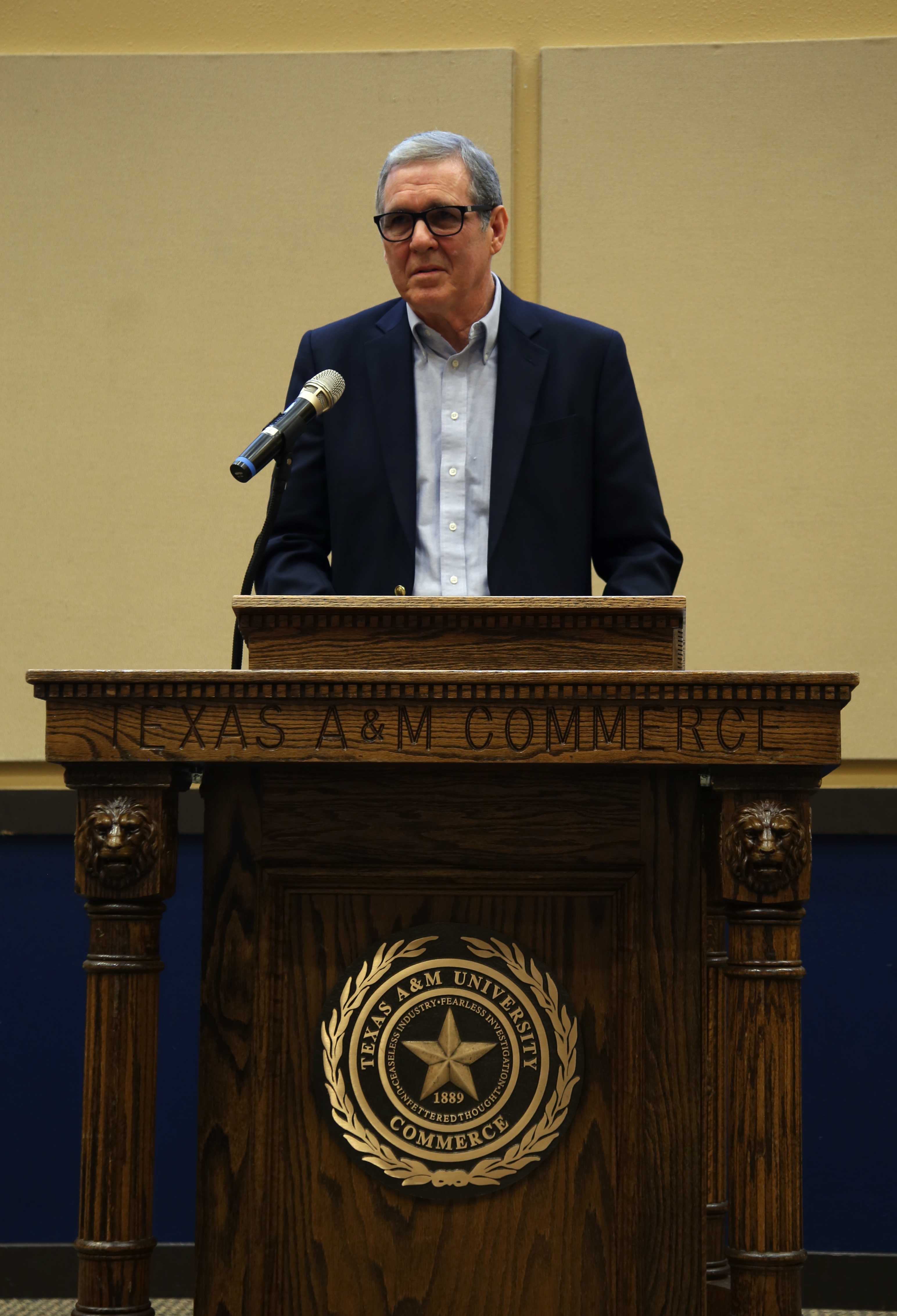 Photo by Eriana Ruiz| John Neal, professor emeritus, speaks at the Texas Community College Journalism Association Convention Oct. 12 after being inducted into the TCCJA Hall of Honor; Neal