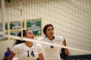 Photo by Malen Blackmon | Morgan Frisby (#14) and Laurissa Zavala (#8) prepare to defend against a spike attempt by Odessa College Aug. 28.