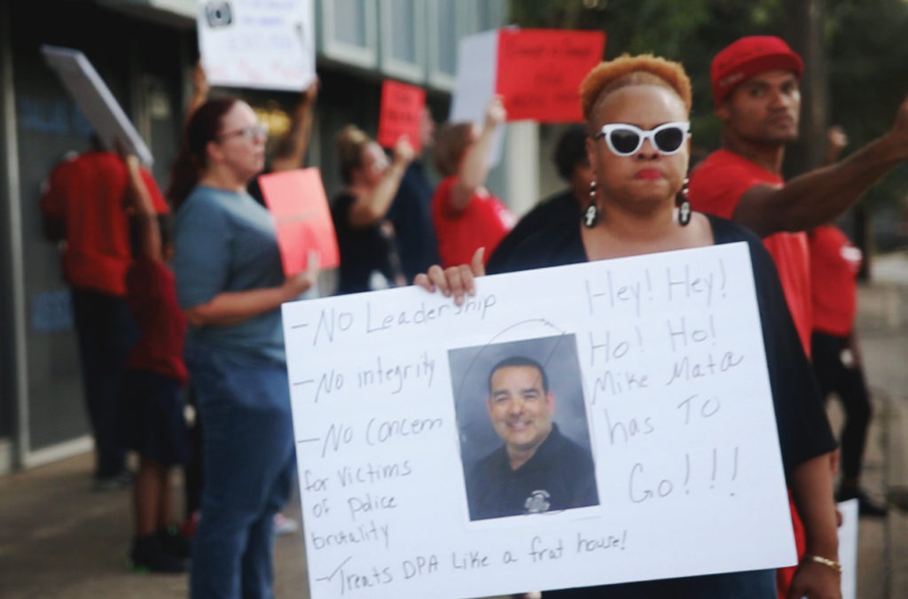 Photo by Jacob Vaughn |  Pamela L. Grayson, a local activist, protests outside the Dallas Police Association building Sept. 27, calling for its president’s resignation.