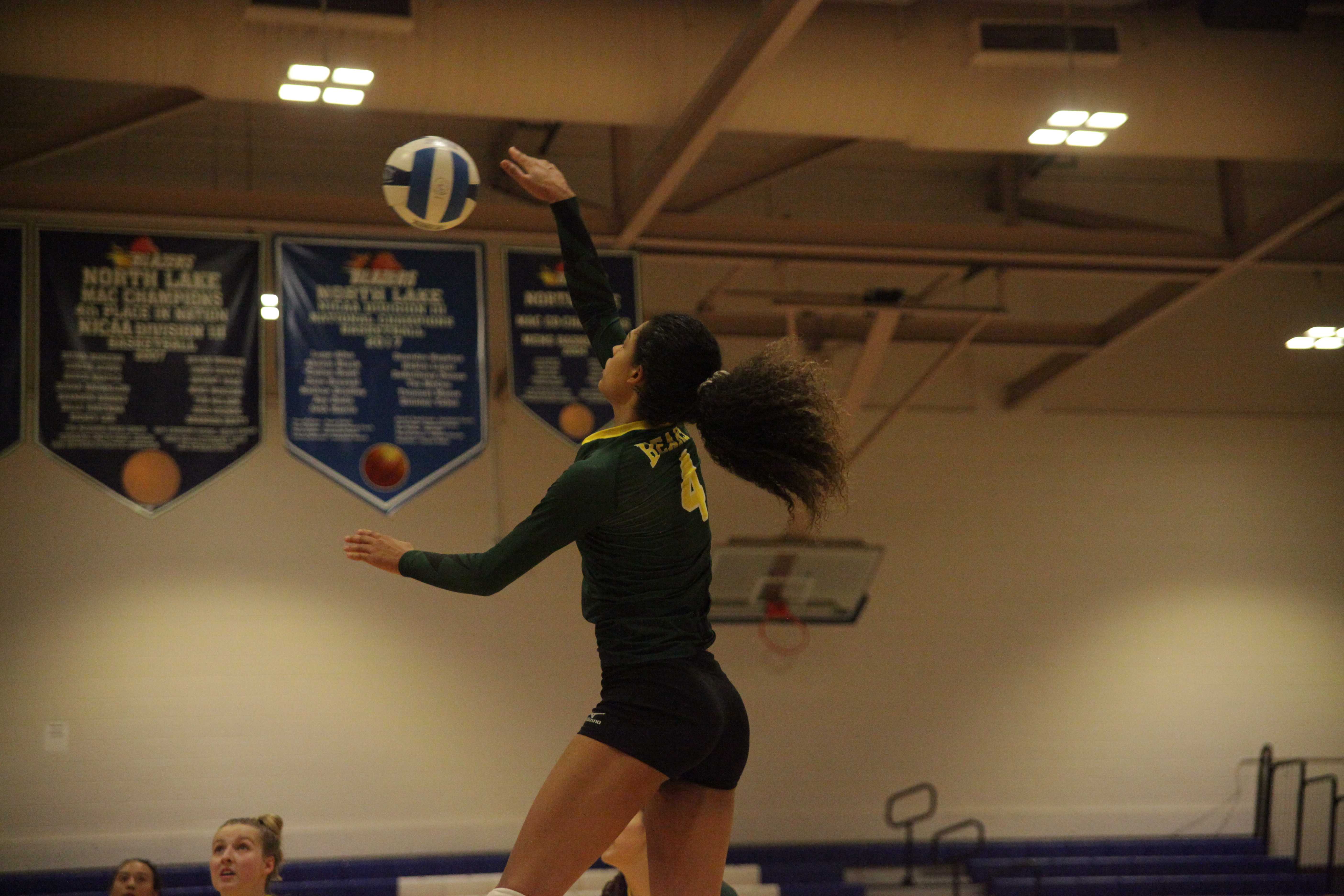 Photo by Malen Blackmon | Bears outside hitter Yasmin Miller (#4) spikes the ball.