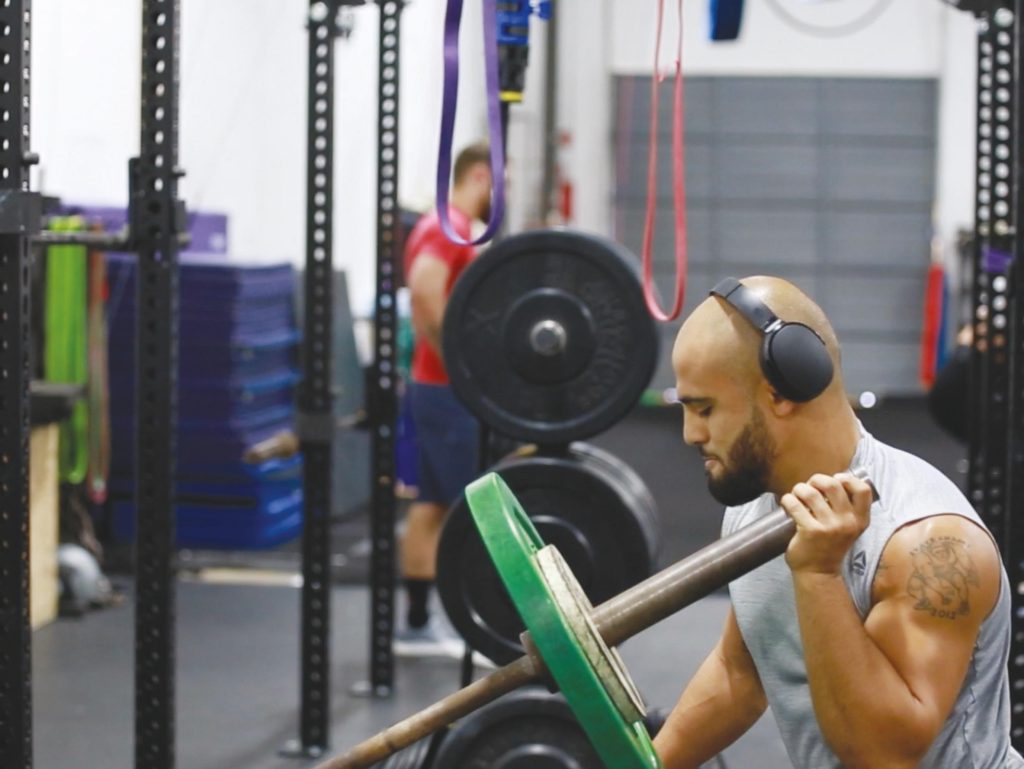 Photo by Jacob Vaughn | Miles Johns, an Ultimate FIghting Champion fighter and former Brookhaven College student, works to strengthen and condition himself Oct. 7 at Extreme Studio Performance, a gym in Dallas.