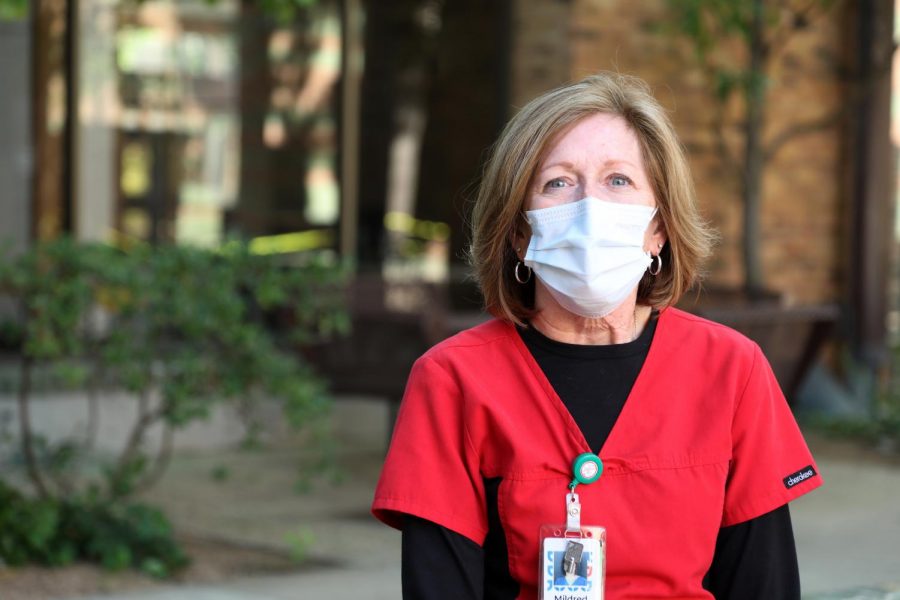 Mildred Kelley, Dallas College Brookhaven Campus lead nurse, continues to wear a protective face mask on campus.