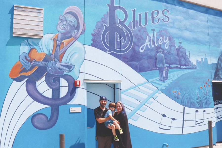 Dan Colcer, his wife and his son pose for a photo in front of ‘Blues Alley,’ a mural created by Dan in collaboration with The Deep Ellum Foundation. Dan enlisted the help of other local artists to paint different sections of the mural.
