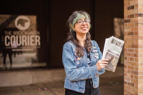Photo of Stephanie Salas-Vega holding newspaper