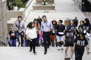Photo of Beto ORourke Climbing Steps and Speaking with crowd