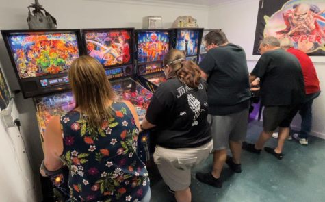 DFW Pinball League members compete on multiple pinball machines for the highest score.