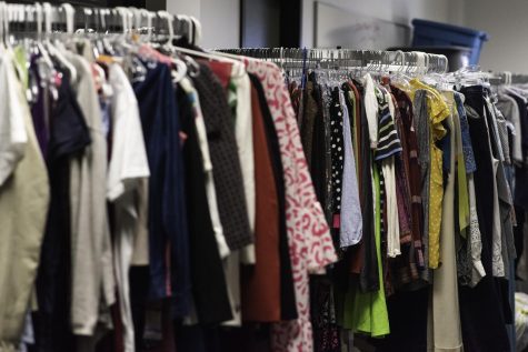 Racks of clothing in Room J104.