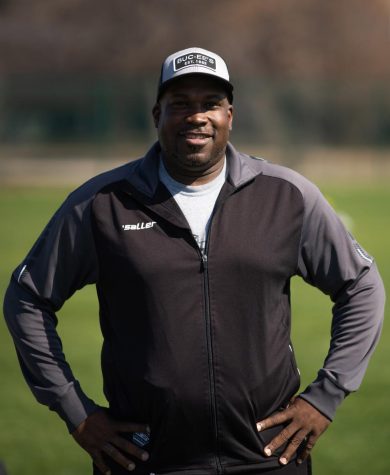 Assistant coach Robert Williams poses for a photo 