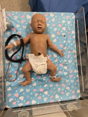 A baby dummy used for practice demonstrations in the nursing classes.
