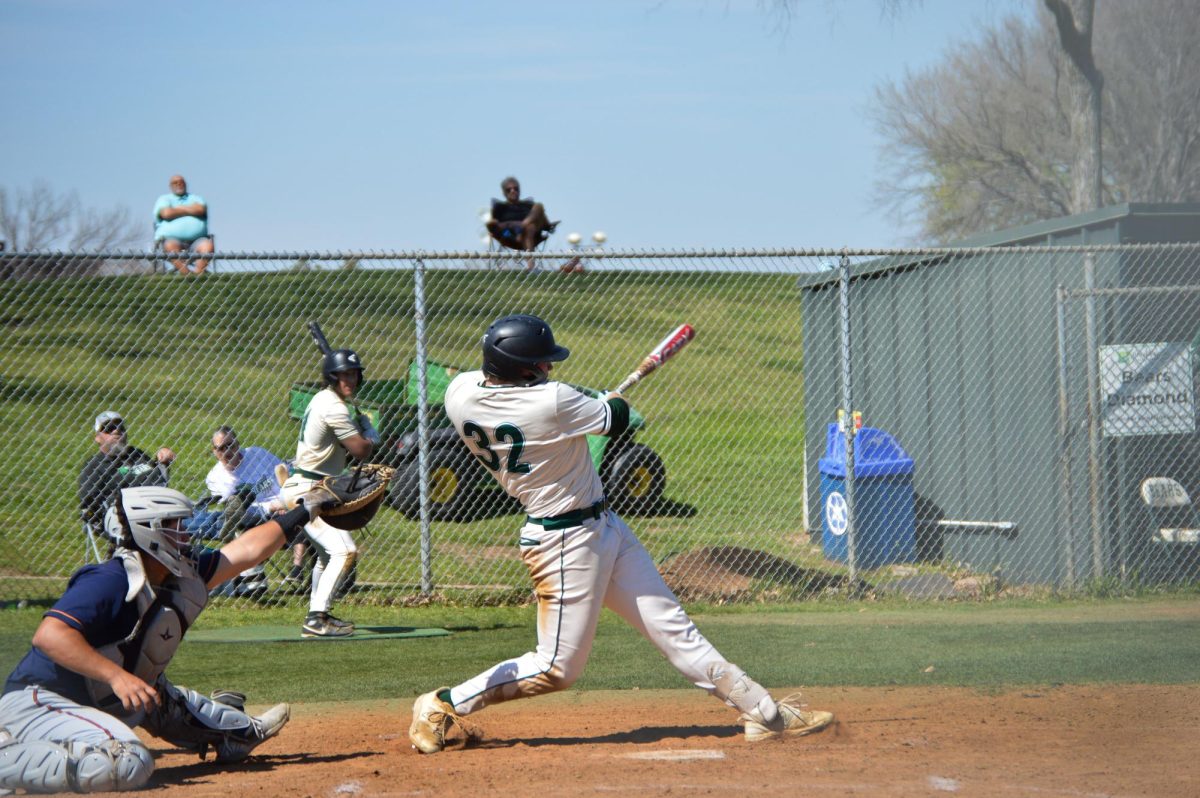 Baseball+player+swings.