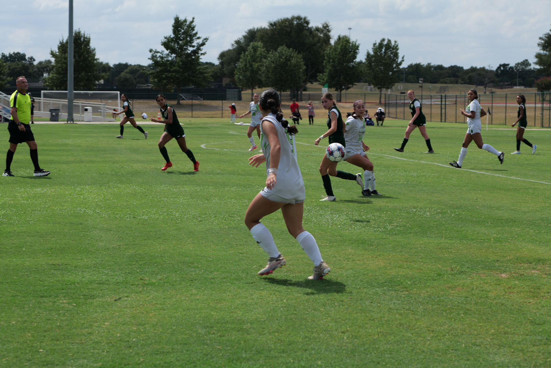 Women playing soccer.