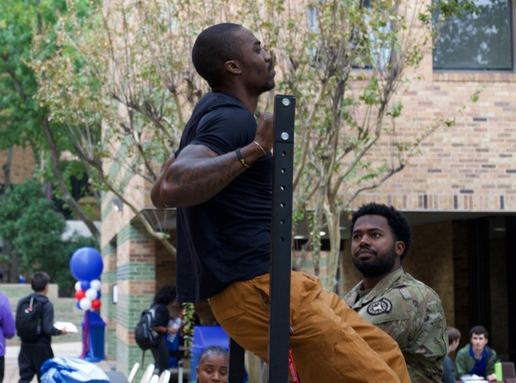 Man doing a pull-up in a pull up bar.