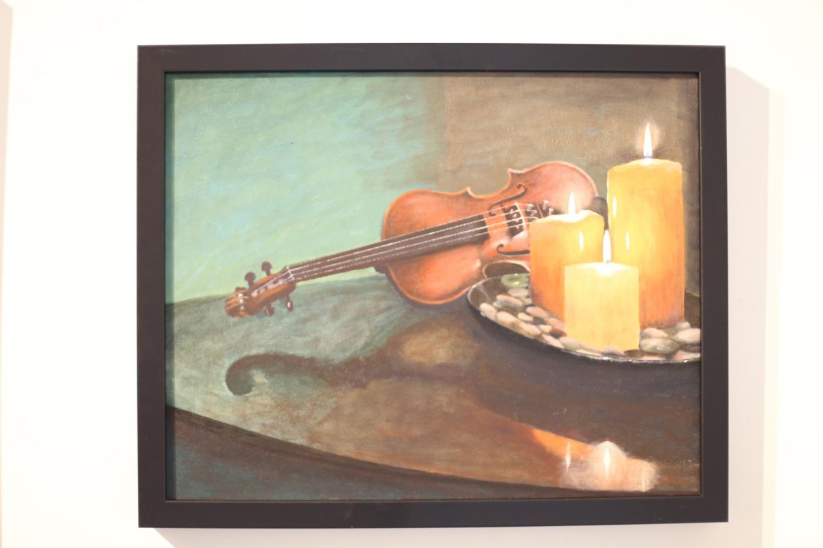 Painting of a violin with candles.