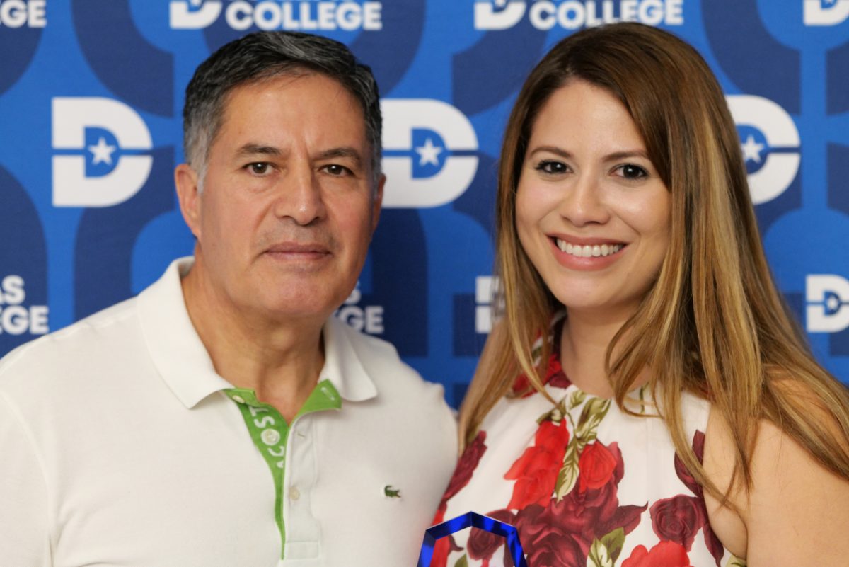 Man and a woman right beside each other in front of a Dallas College background.