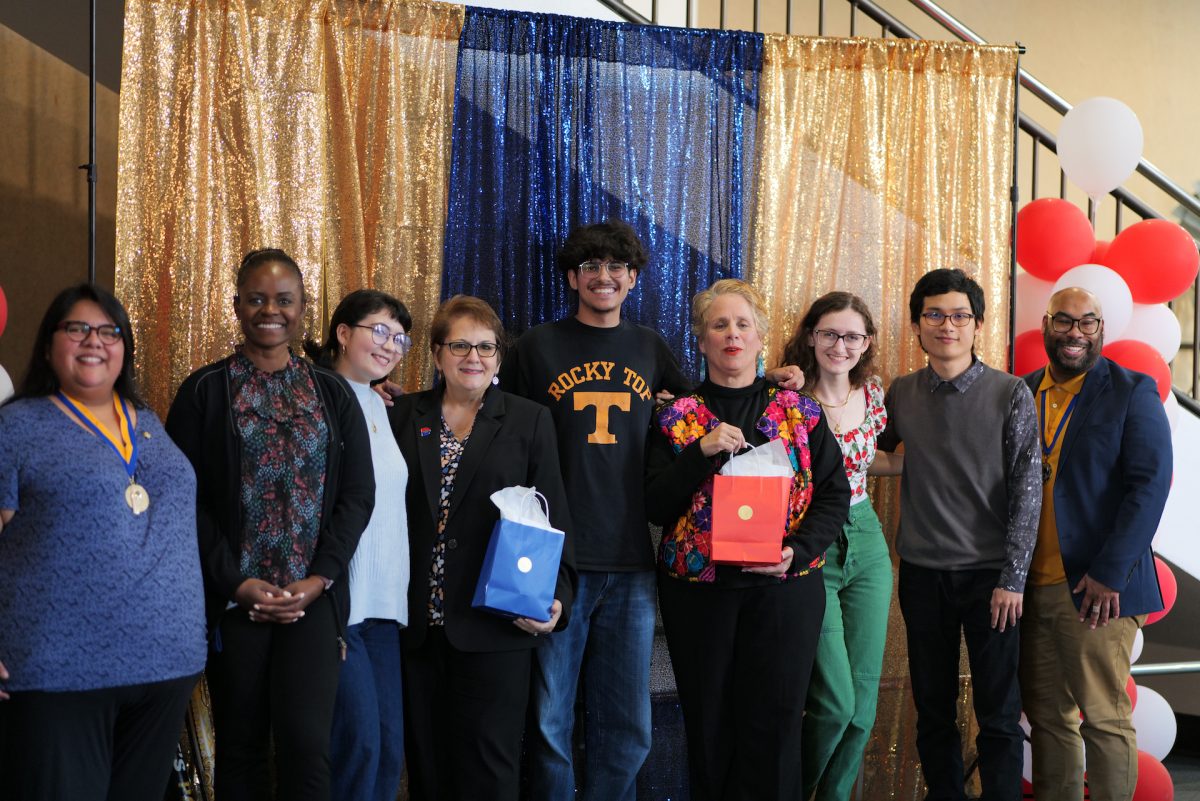 Staff and students pose for the camera.