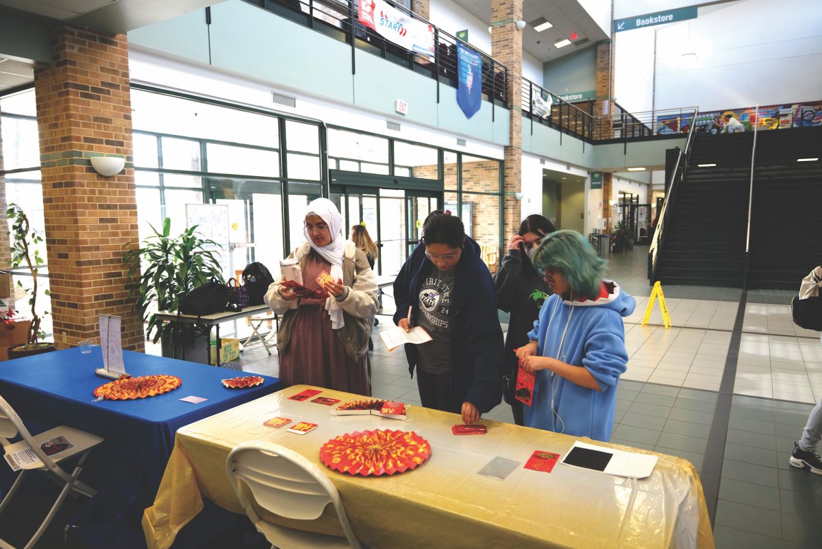 Brookhaven community picks up red envelopes to celebrate the lunar new year.