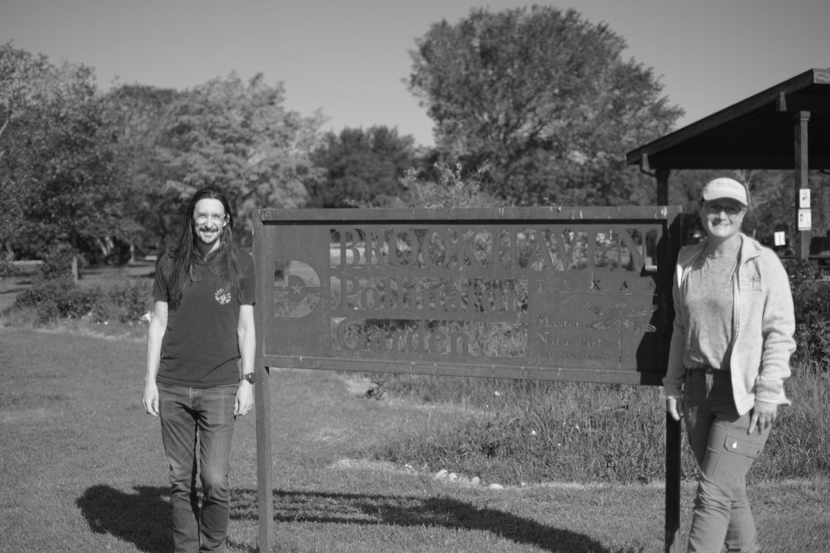 Sandra Horton and Justin Langhurst pose by the sign of the Brookhaven Pollinator Garden. Horton and Langhurst are the are the managers of the garden, co-leading as part of the Texas Master Naturalist North Texas chapter.