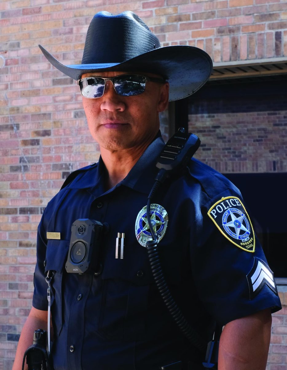 Officer Vilai Thonginh wearing his signature black cowboy hat on campus.
