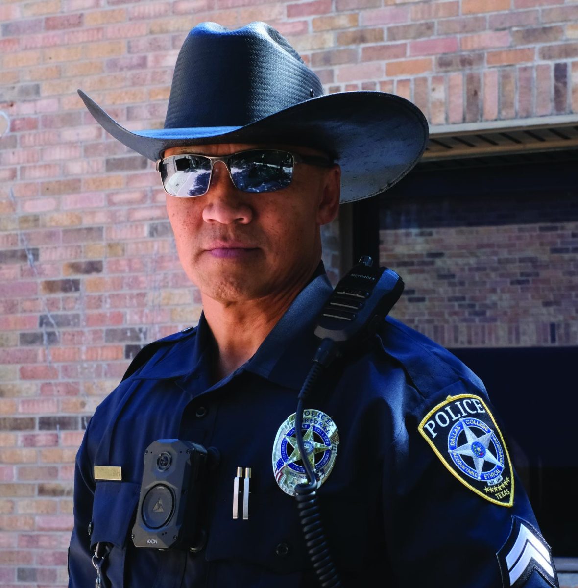 Officer Vilai Thonginh wearing his signature black cowboy hat on campus.