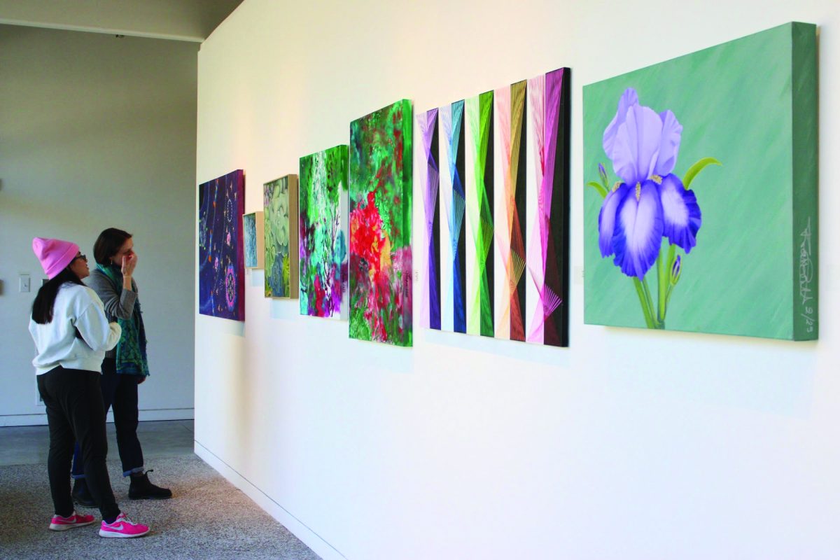 Various painting canvases on display for the Student Fall Exhibition 2025.