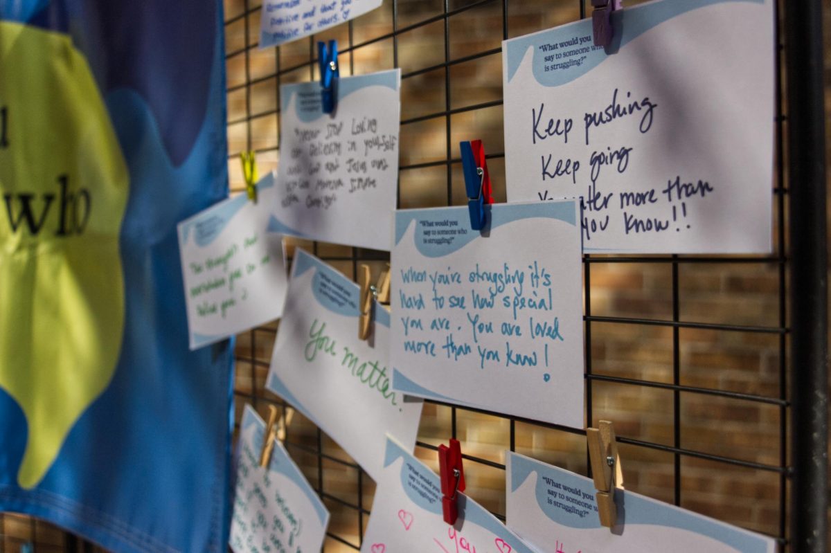 A wall filled with notes of love and affection to those who are struggling mentally is diplayed at Brookhaven’s Commons Courtyard Nov. 13.