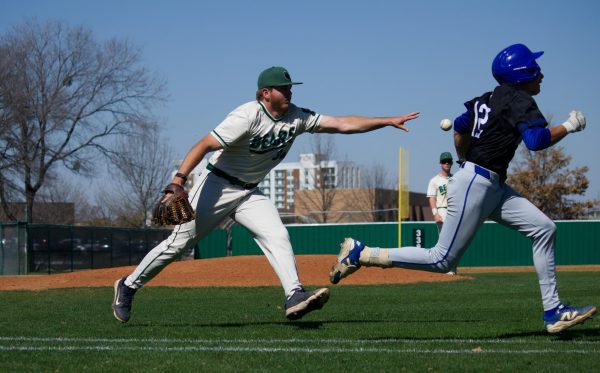 Isaiah Hill (#36) throws the ball to first base for an out at the top of the fourth inning.