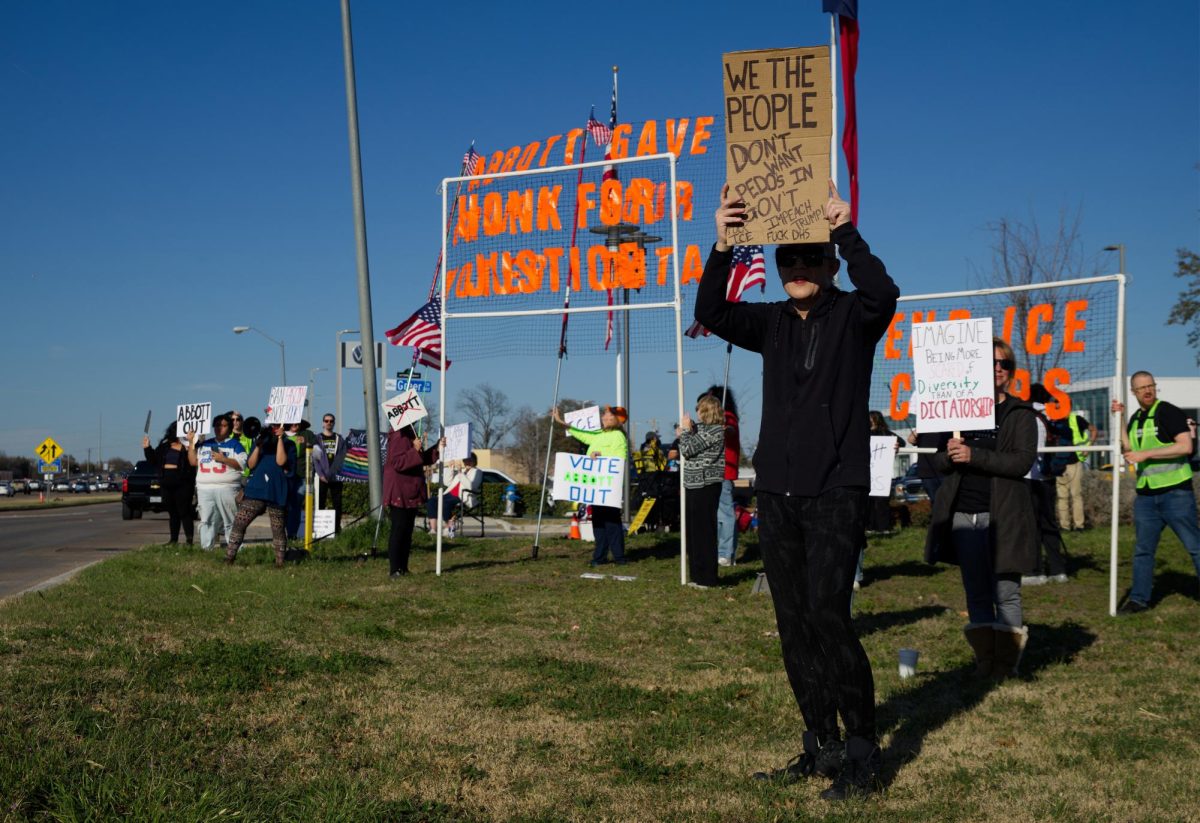 Protesters gathered outside of the Spring Creek Barbeque in Richardson against Gov. Greg Abbott.