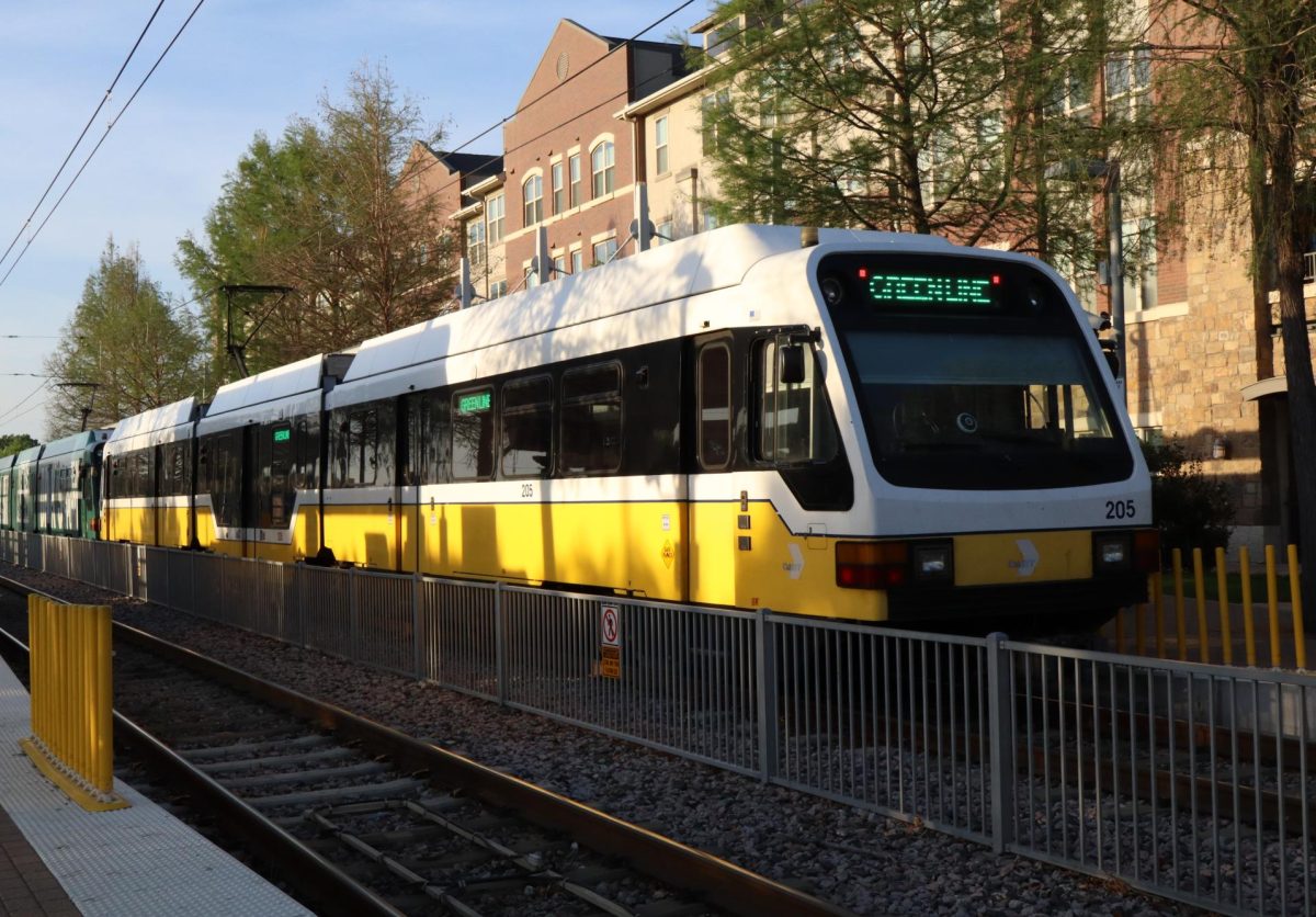 A greenline DART train leaving Farmers Branch station.