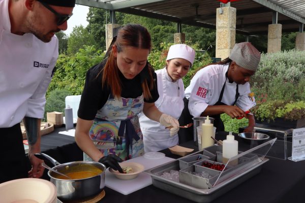 From left to right, Aaron Beckle, Andrea Saldana, Lisa Oliveros and Kayla Alexander prepare a pork belly dish.
